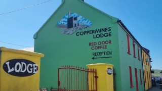 Exterior of the Allihies Coppermines Lodge on a sunny day