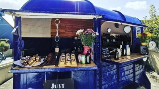 The royal blue Drip Coffee Truck on Warren Strand on a sunny day in Rosscarebery