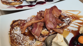 breakfast plate with pancakes and bacon