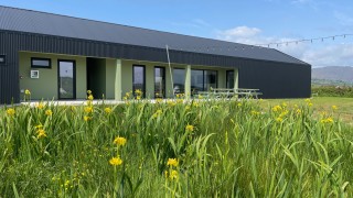 The outside of the Wild Atlantic Glamping campsite building on Bere Island